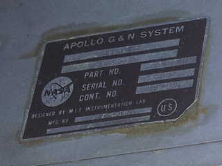 Rear plate on the AGC borrowed in 2019 reading APOLLO G & N SYSTEM (guidance and navigation system) and DESIGNED BY MIT INSTRUMENTATION LAB
