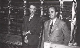Drs. J. Robert Oppenheimer and John von Neumann in October 1952 with the IAS Machine at the Institute for Advanced Study (IAS) in Princeton, NJ